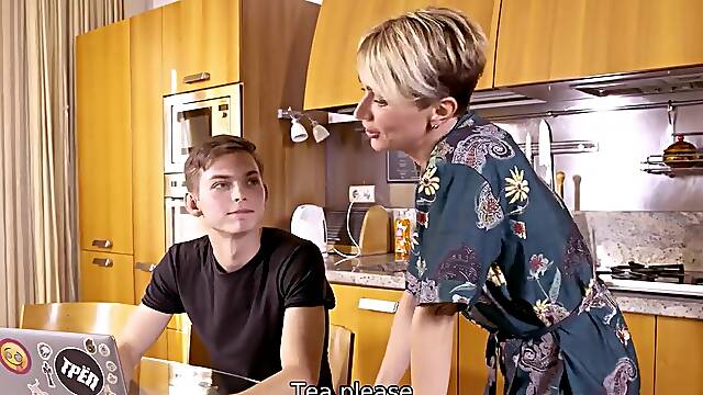 Russian mature lady is going to fuck him up in the kitchen